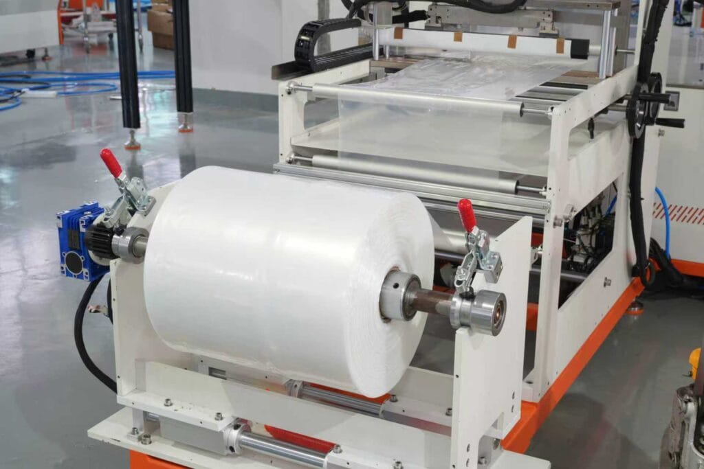Bagging machine PP film roll structure detail - automatic film wrapping, cutting and packaging system for product bagging process