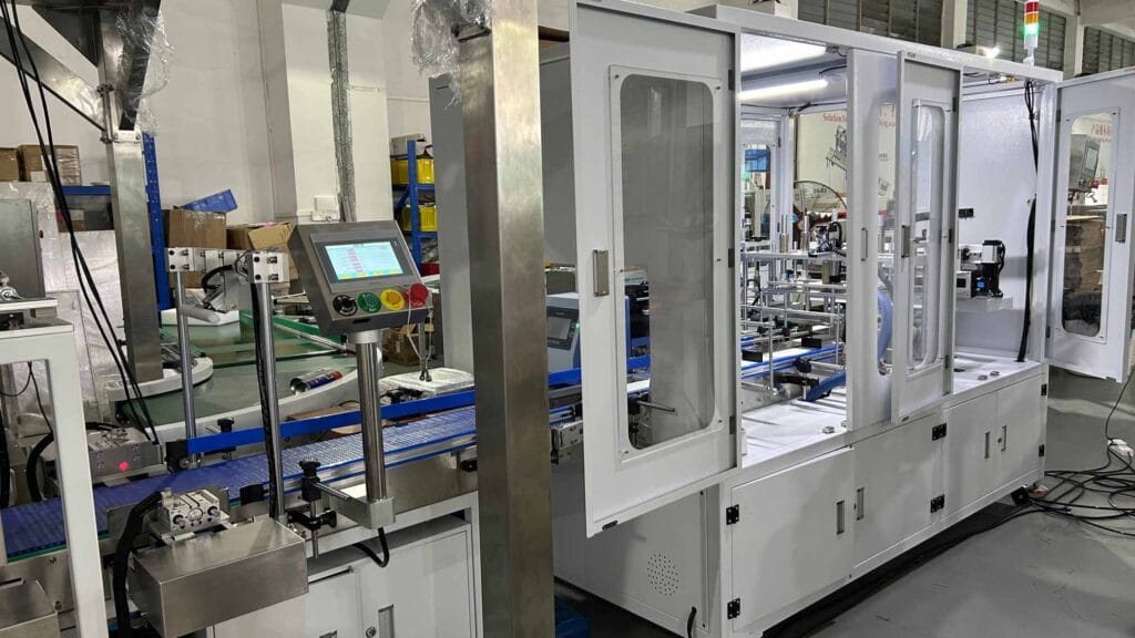 Field photo of UBL aircraft box folding machine connected with other packaging equipment